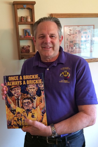 Paul Addison holding "Once a Brickie, Always a Brickie"