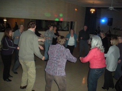 Circle dancing at the HHSAA dance at Rosser Hall on March 23