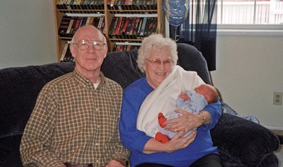 Olive Rees GIbson photo with husband Jack (and probably grandchild), Class of 1939